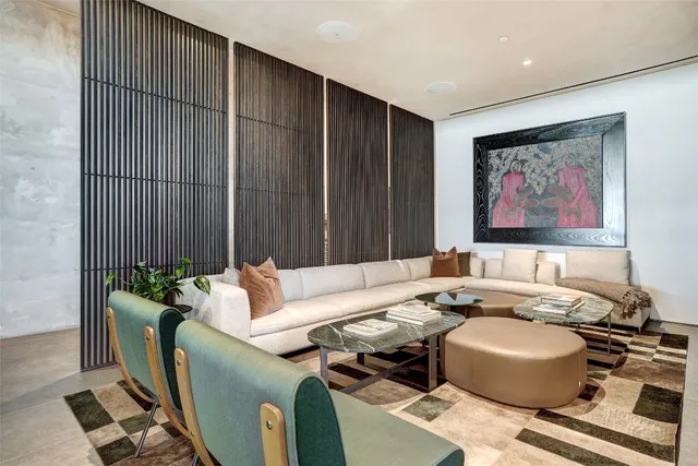 a living room with furniture and a painting