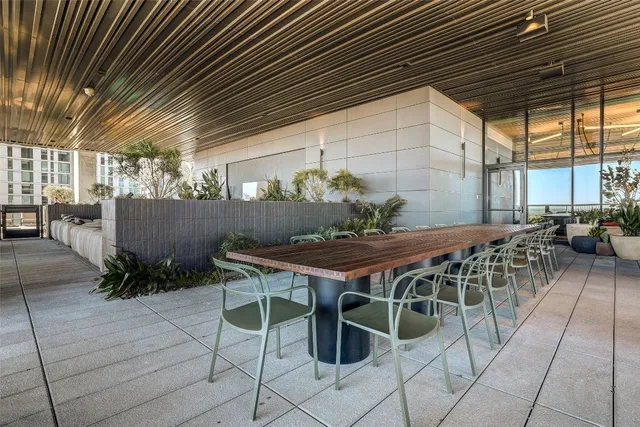 a patio with table and chairs