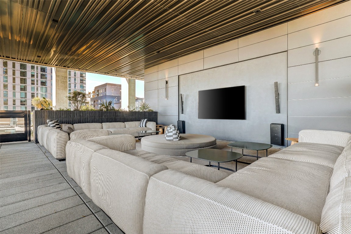 610 Davis Street, Unit 3008 Austin, TX 78701 - Photo 32 of 39 a living room with furniture and a flat screen tv