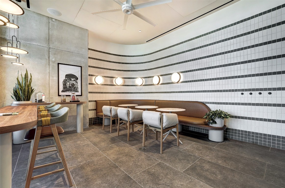 610 Davis Street, Unit 3008 Austin, TX 78701 - Photo 34 of 39 a view of a patio with table and chairs