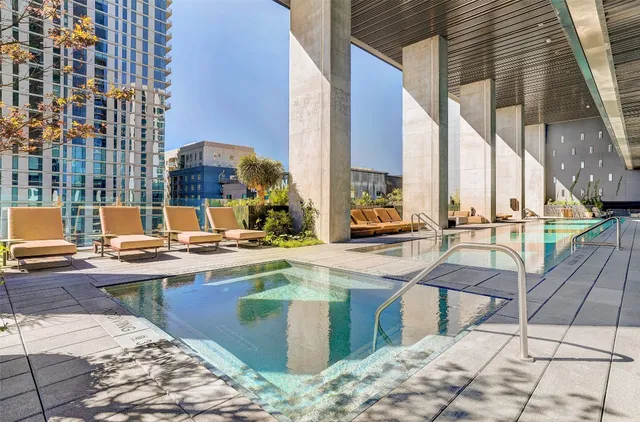 a view of swimming pool with chairs