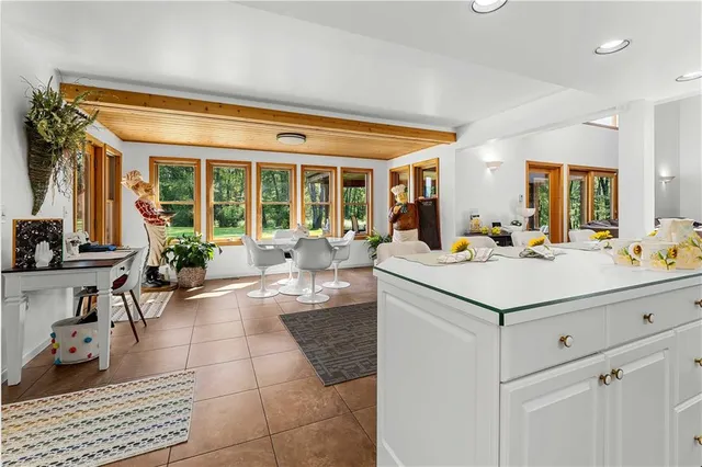 a view of a kitchen counter space and living room