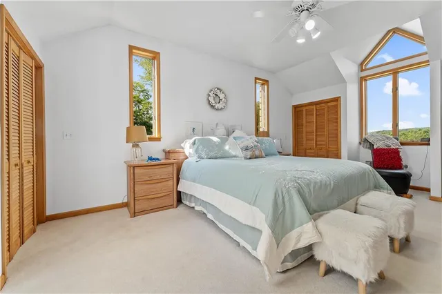 a spacious bedroom with a bed and window