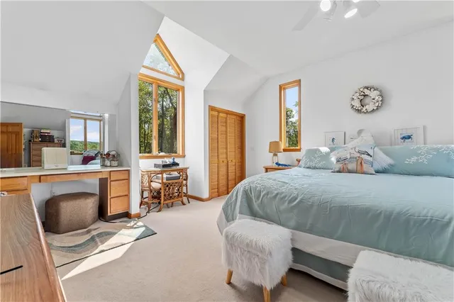 a bedroom with a bed and a couch