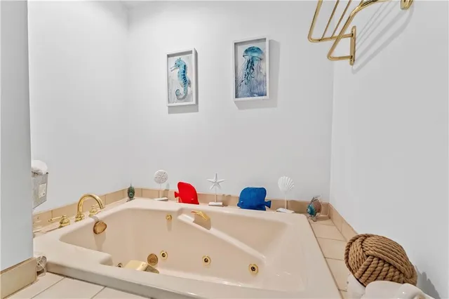 a bathroom with a tub and a shower