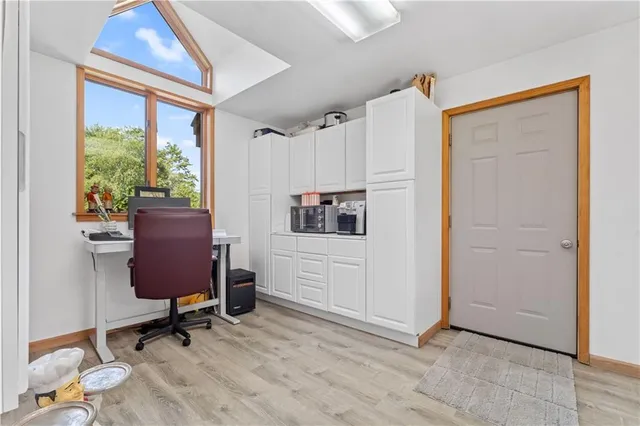 a workspace with furniture and a window