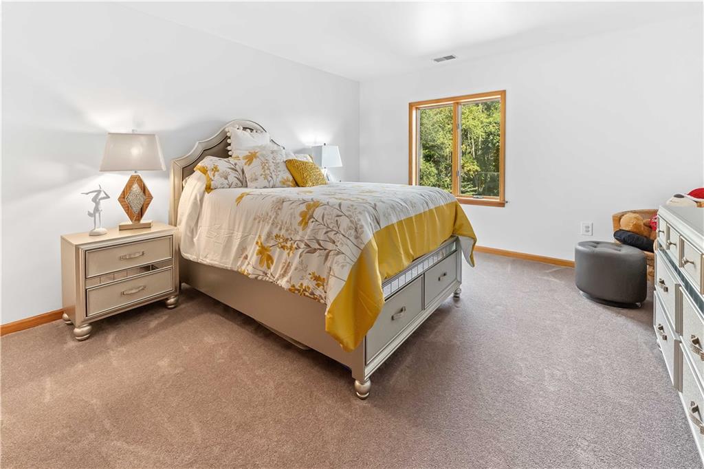 171 Mae West Road Confluence, PA 15424 - Photo 34 of 46 a spacious bedroom with a bed and a window