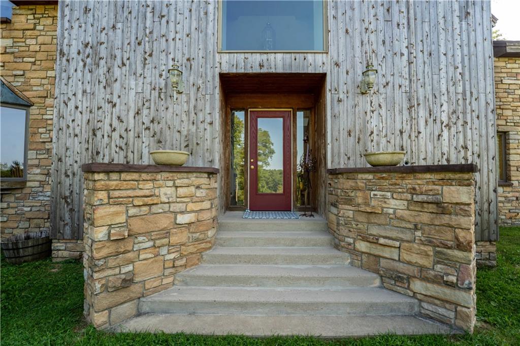 171 Mae West Road Confluence, PA 15424 - Photo 4 of 46 a front view of a house with an outdoor space