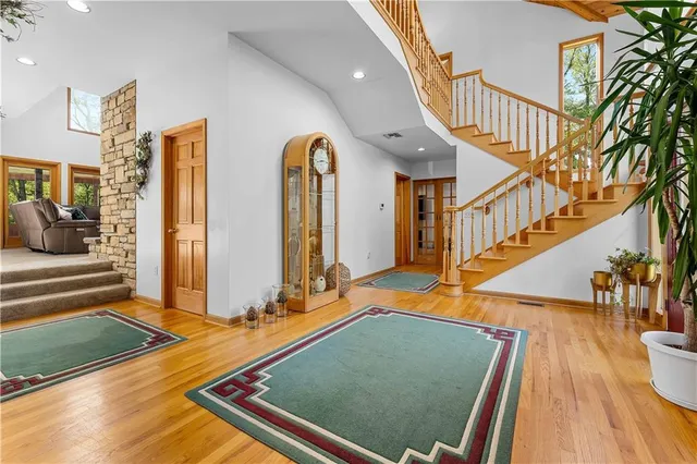 a view of a living room and entryway