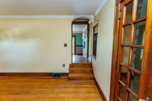 a kitchen with granite countertop a refrigerator and a sink