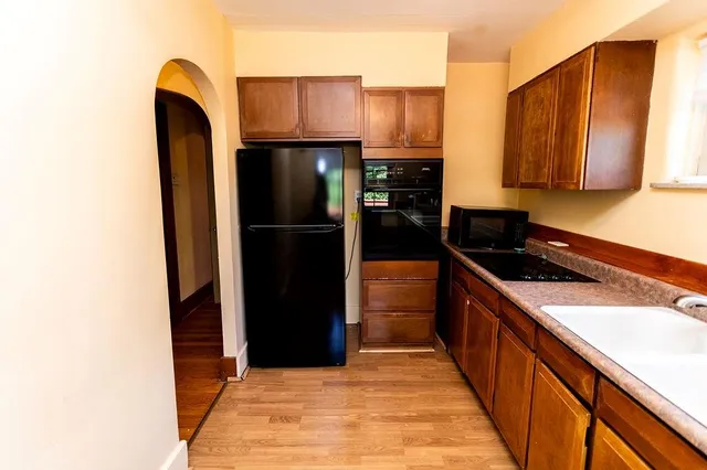 a bathroom with a sink a mirror and shower
