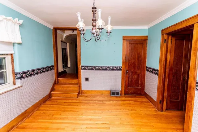 a view of entryway with window and a ceiling fan