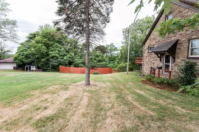 a view of a yard with a tree