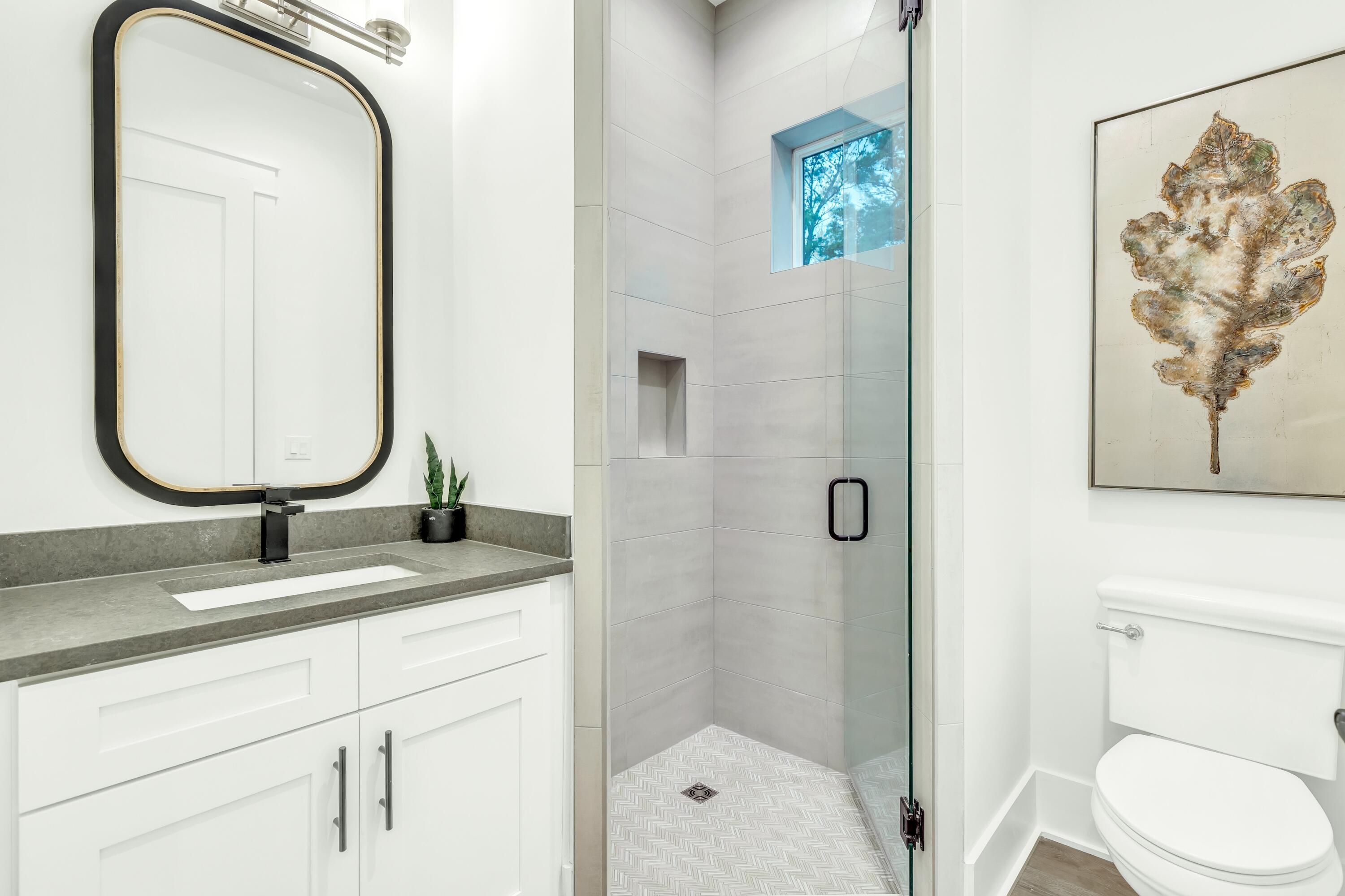 20 Sea Croft Drive Santa Rosa Beach, FL 32459 - Photo 14 of 54 a bathroom with a granite countertop toilet sink and mirror