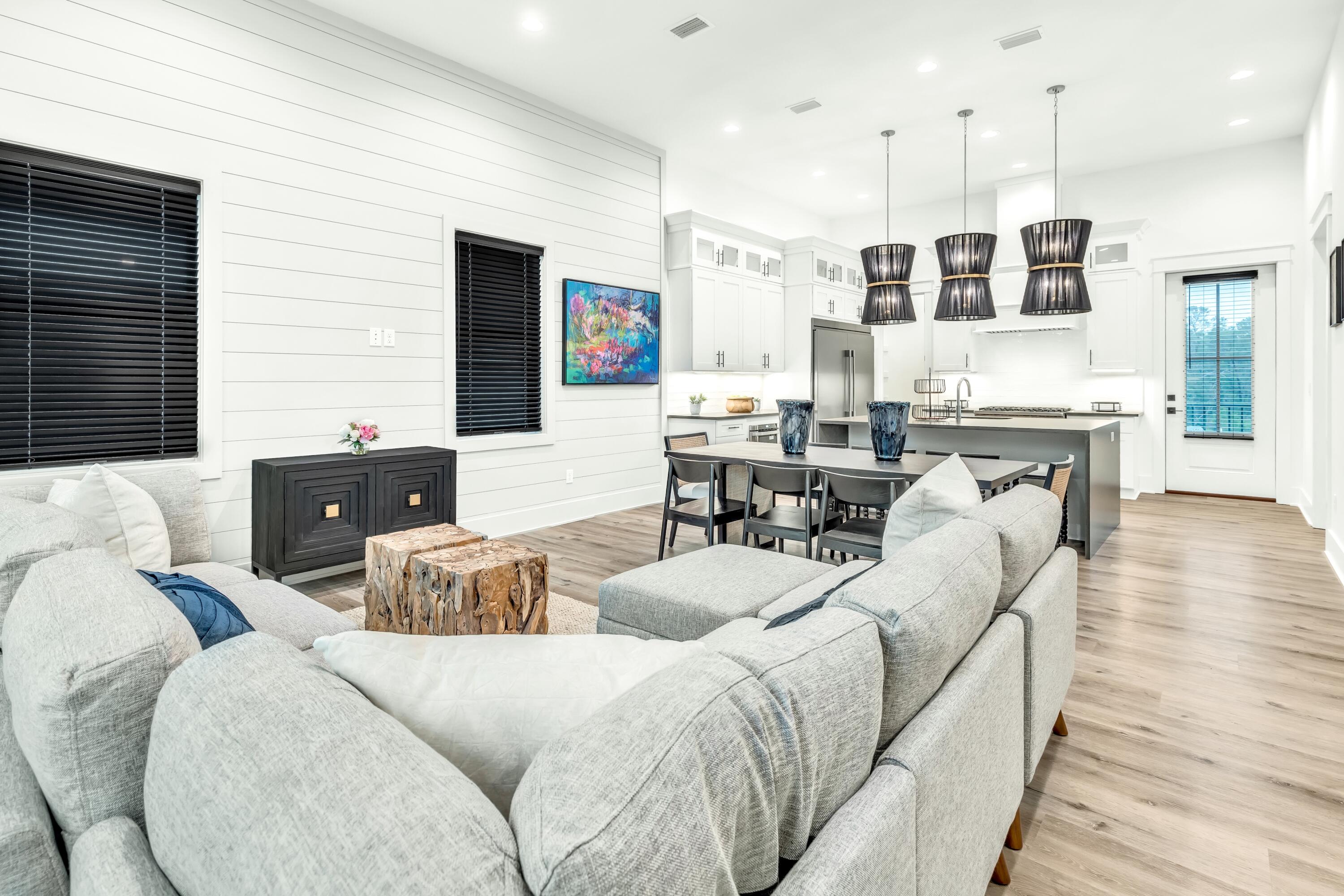 20 Sea Croft Drive Santa Rosa Beach, FL 32459 - Photo 19 of 54 a living room with couches and kitchen view with wooden floor