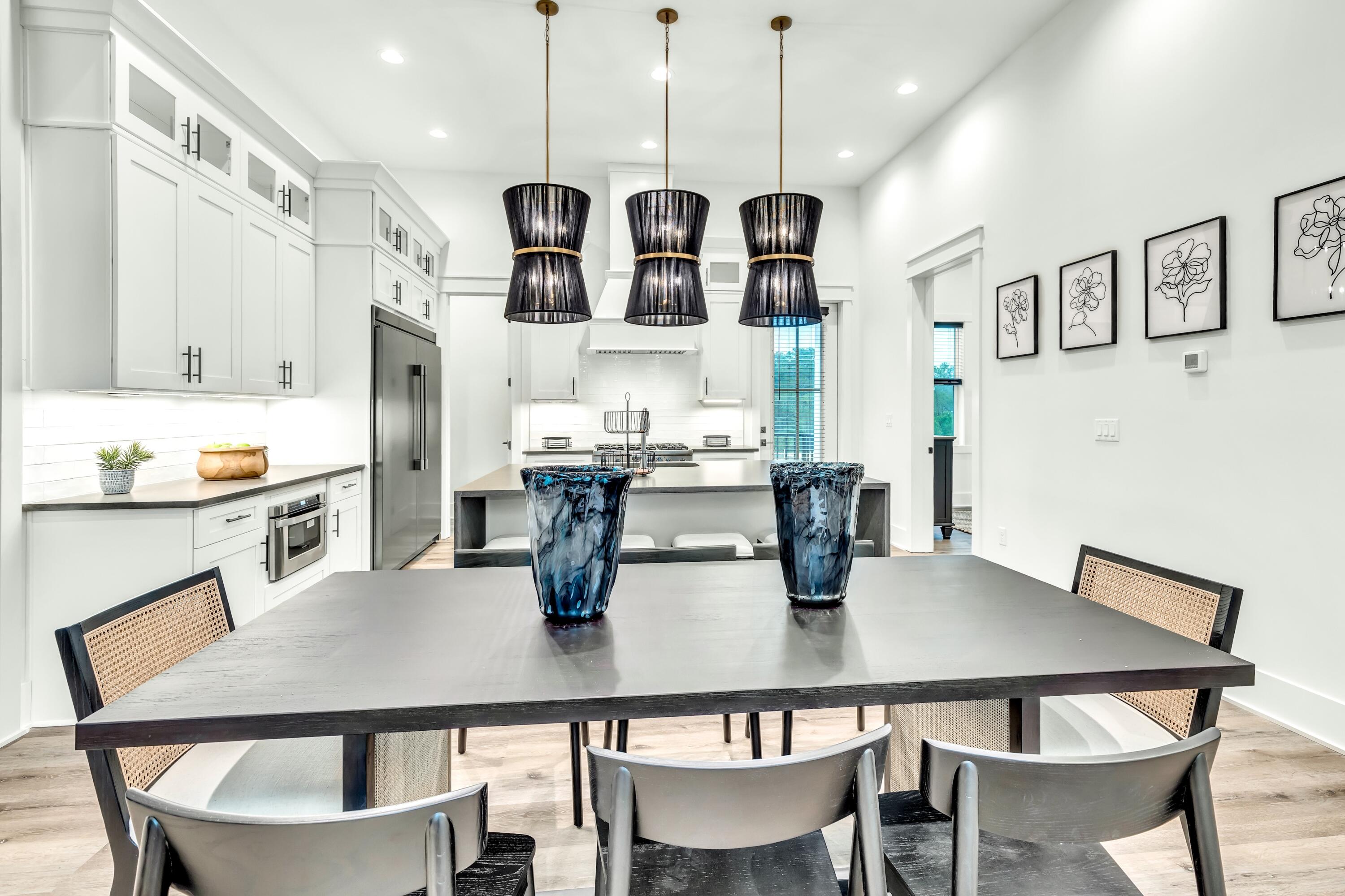 20 Sea Croft Drive Santa Rosa Beach, FL 32459 - Photo 21 of 54 a kitchen with stainless steel appliances granite countertop a dining table and chairs