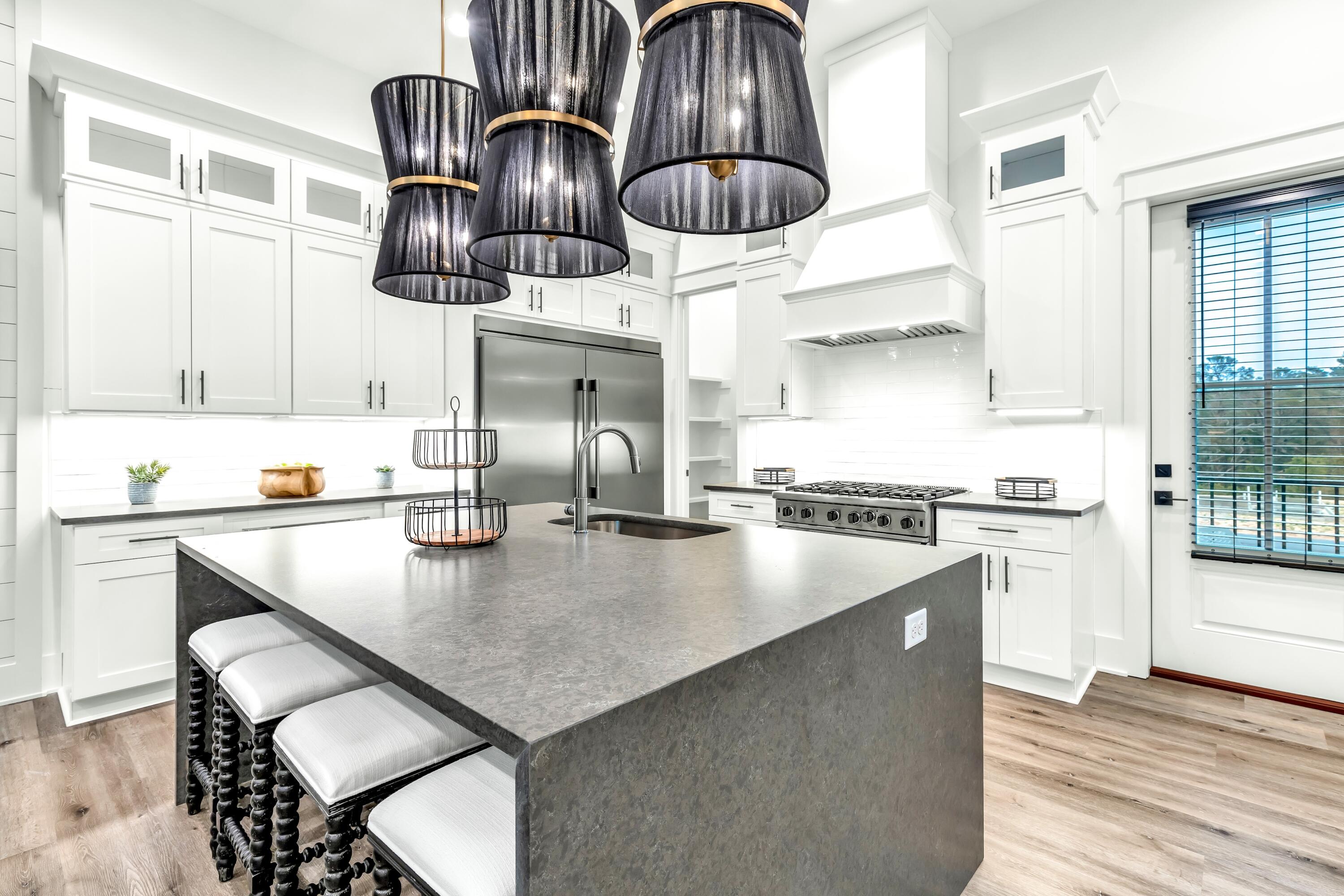 20 Sea Croft Drive Santa Rosa Beach, FL 32459 - Photo 22 of 54 a kitchen with a stove a table and chairs