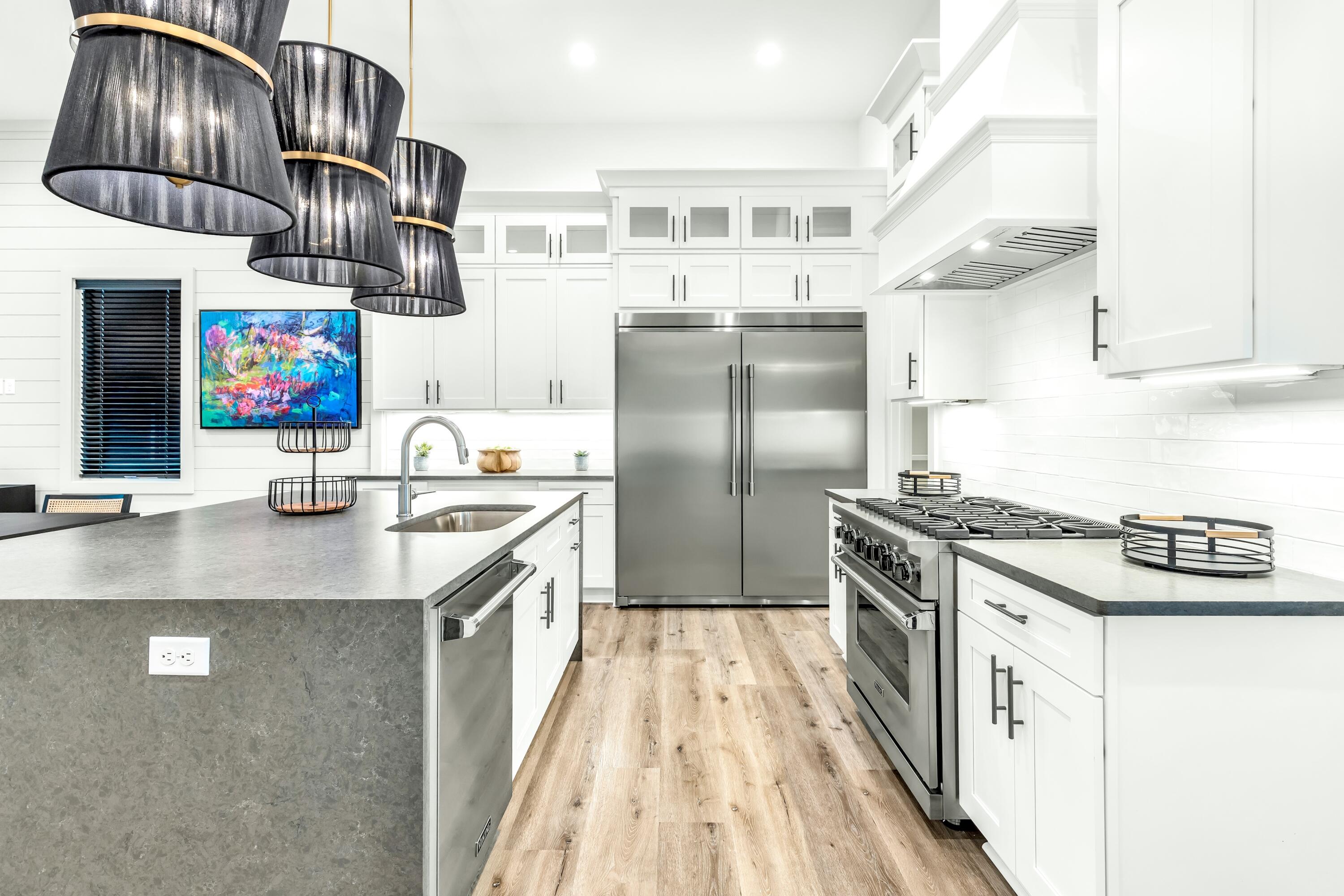 20 Sea Croft Drive Santa Rosa Beach, FL 32459 - Photo 24 of 54 a kitchen with stainless steel appliances granite countertop a sink a stove and refrigerator