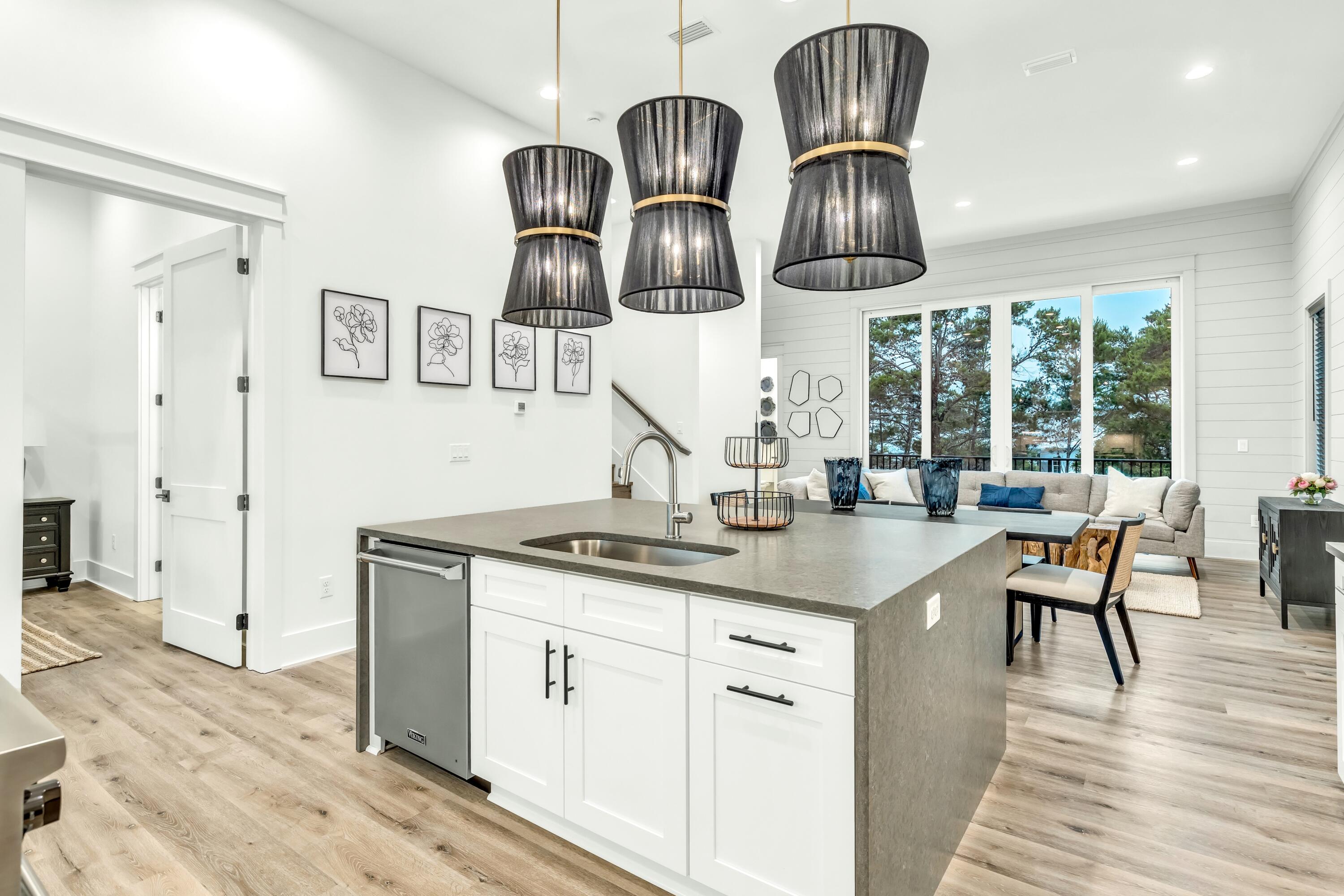 20 Sea Croft Drive Santa Rosa Beach, FL 32459 - Photo 27 of 54 a kitchen with stainless steel appliances granite countertop a sink a stove and wooden floors