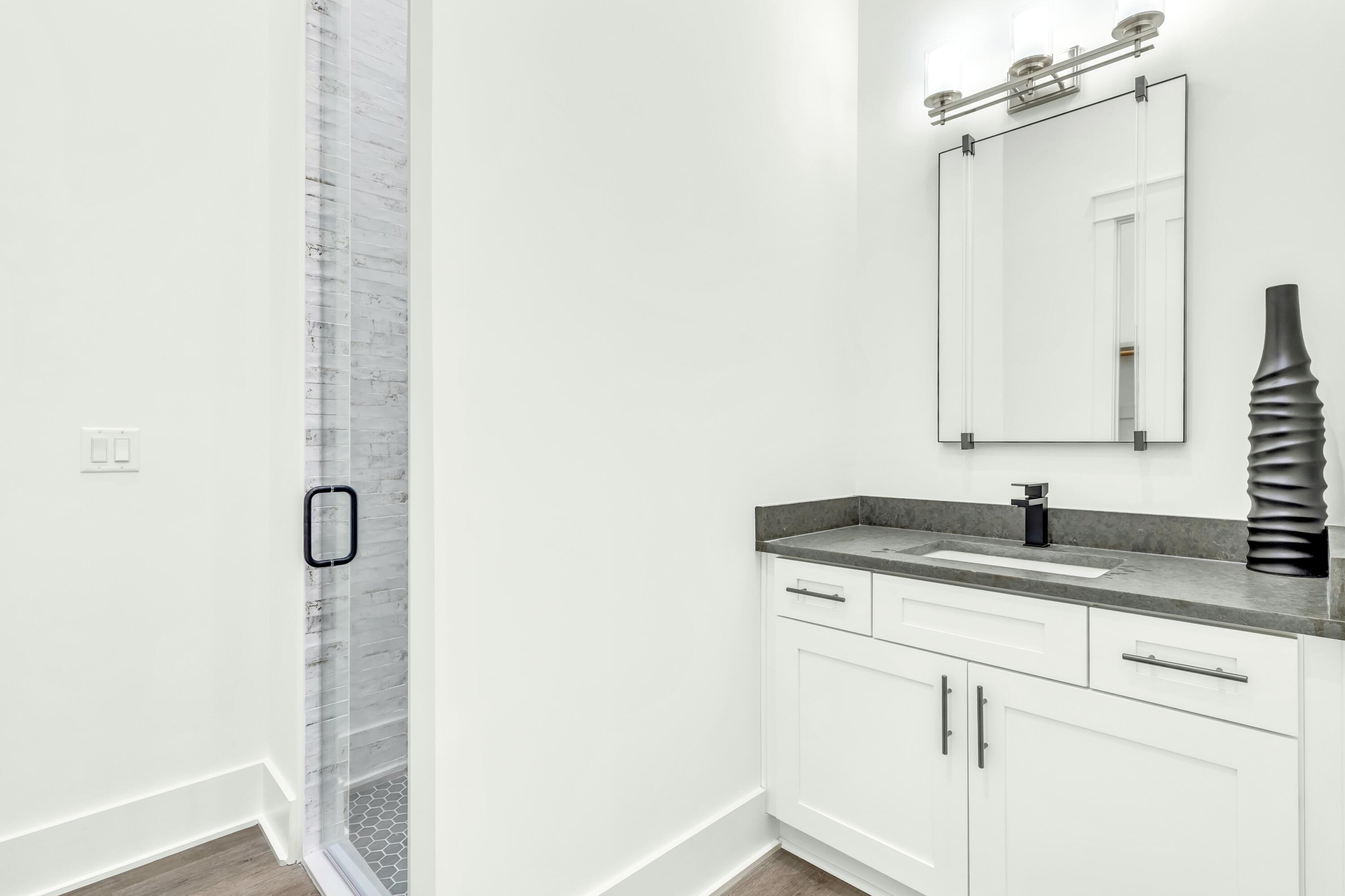20 Sea Croft Drive Santa Rosa Beach, FL 32459 - Photo 29 of 54 a bathroom with a granite countertop sink a vanity and a mirror