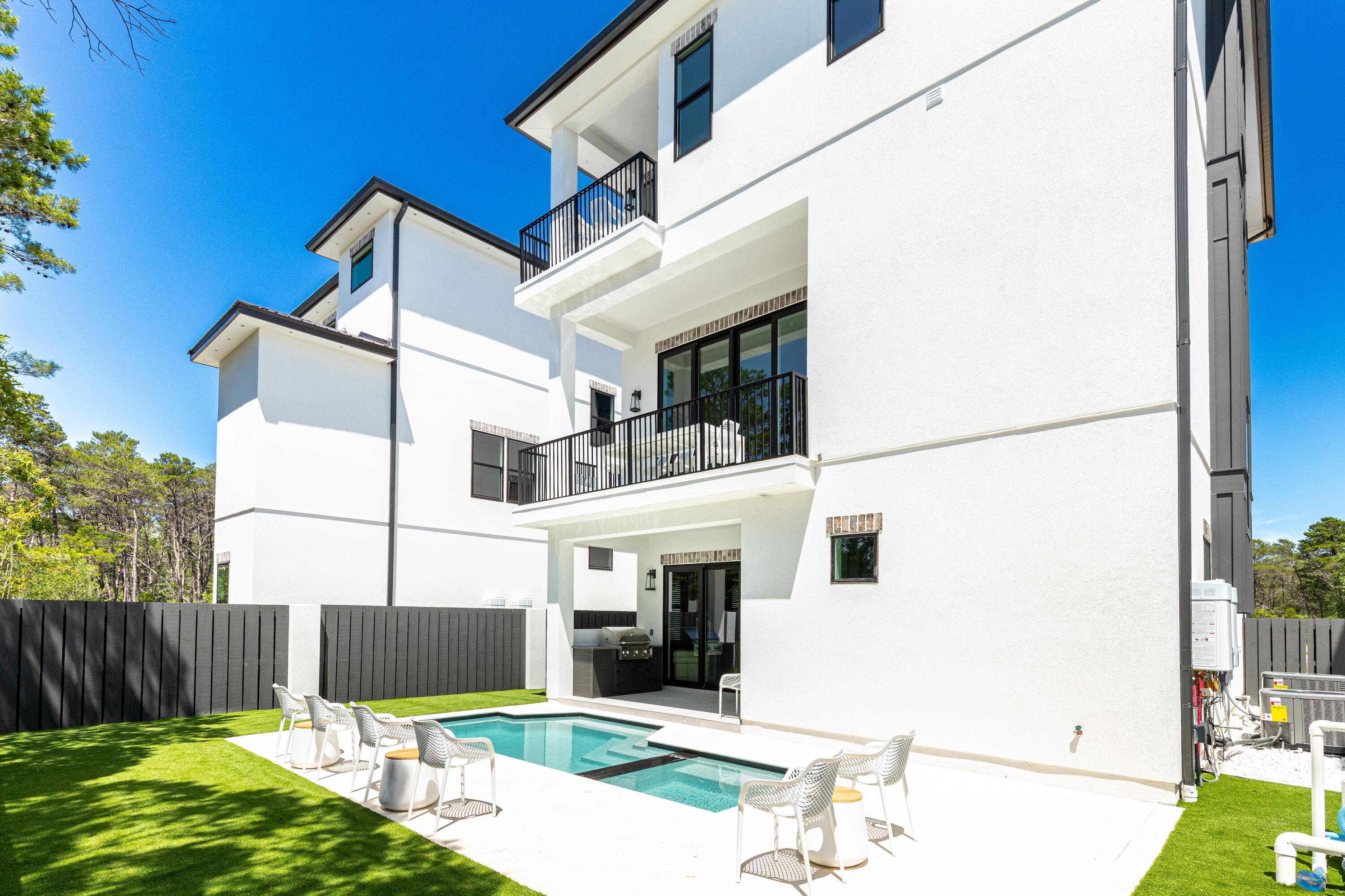 20 Sea Croft Drive Santa Rosa Beach, FL 32459 - Photo 3 of 54 a view of a white house with iron fence