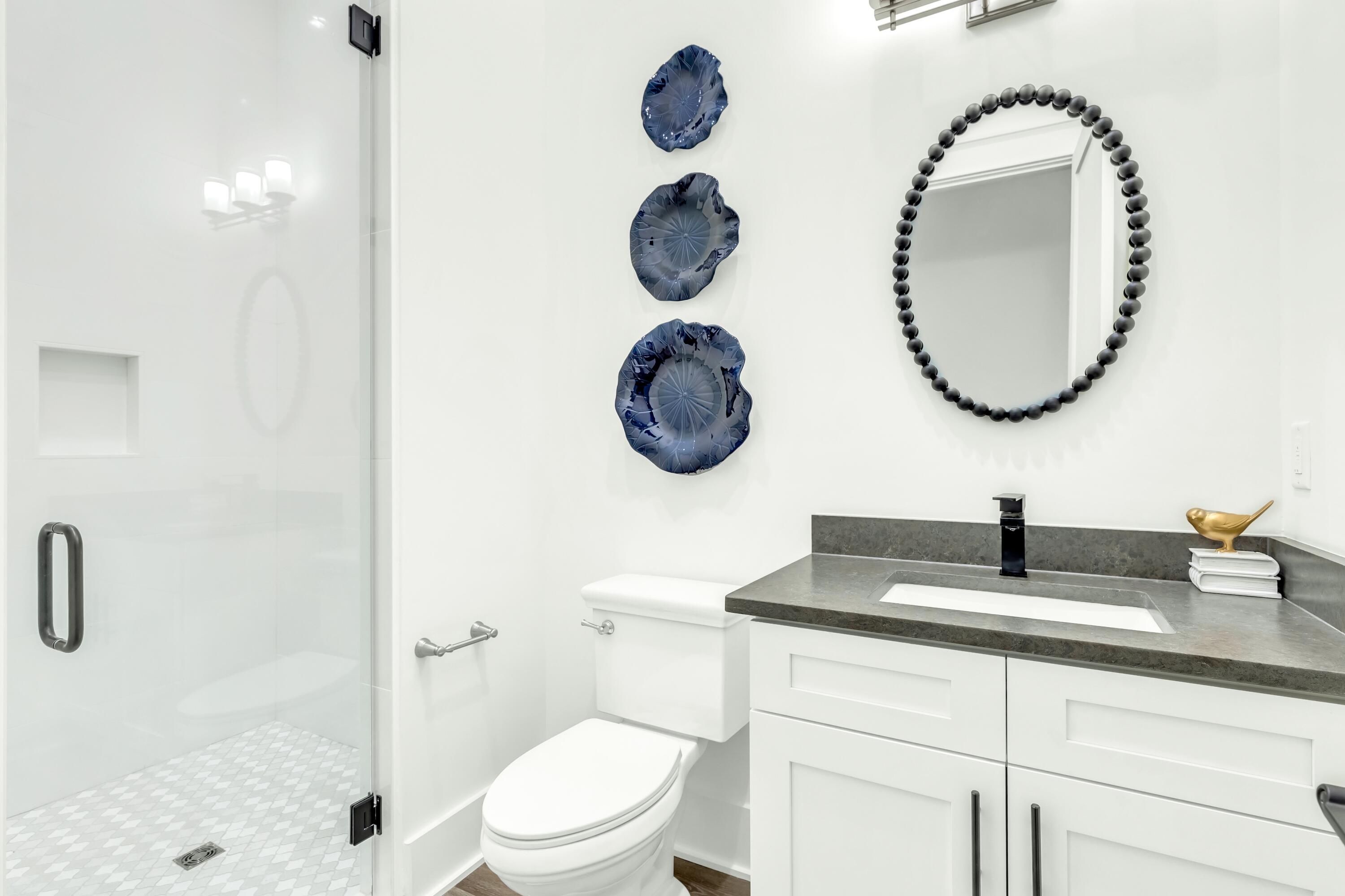 20 Sea Croft Drive Santa Rosa Beach, FL 32459 - Photo 32 of 54 a bathroom with a toilet a sink and mirror