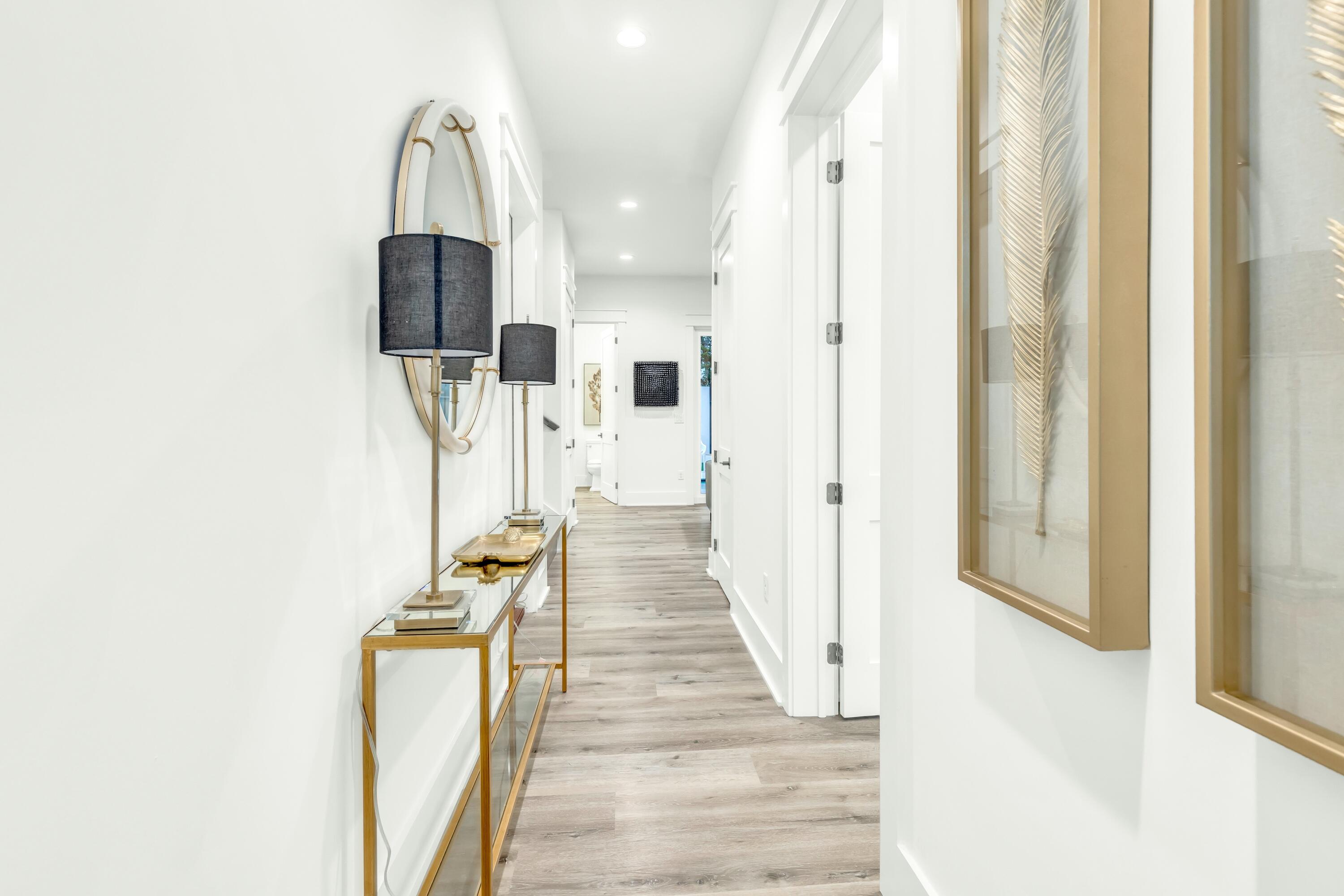 20 Sea Croft Drive Santa Rosa Beach, FL 32459 - Photo 4 of 54 a view of a hallway with wooden floor and staircase