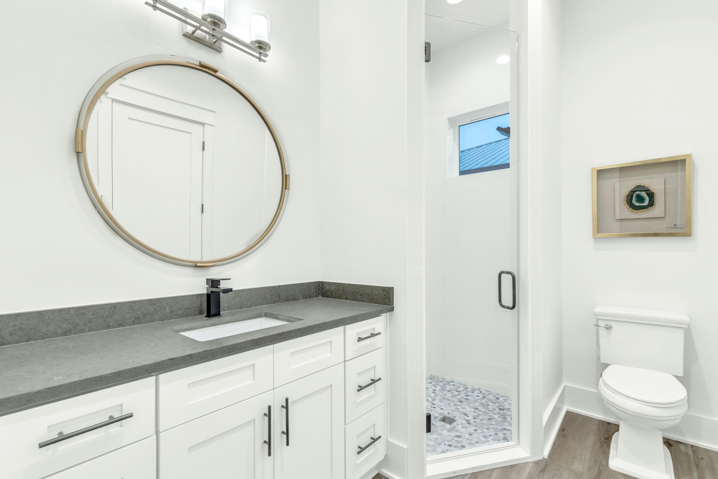 20 Sea Croft Drive Santa Rosa Beach, FL 32459 - Photo 41 of 54 a bathroom with a granite countertop toilet sink and mirror