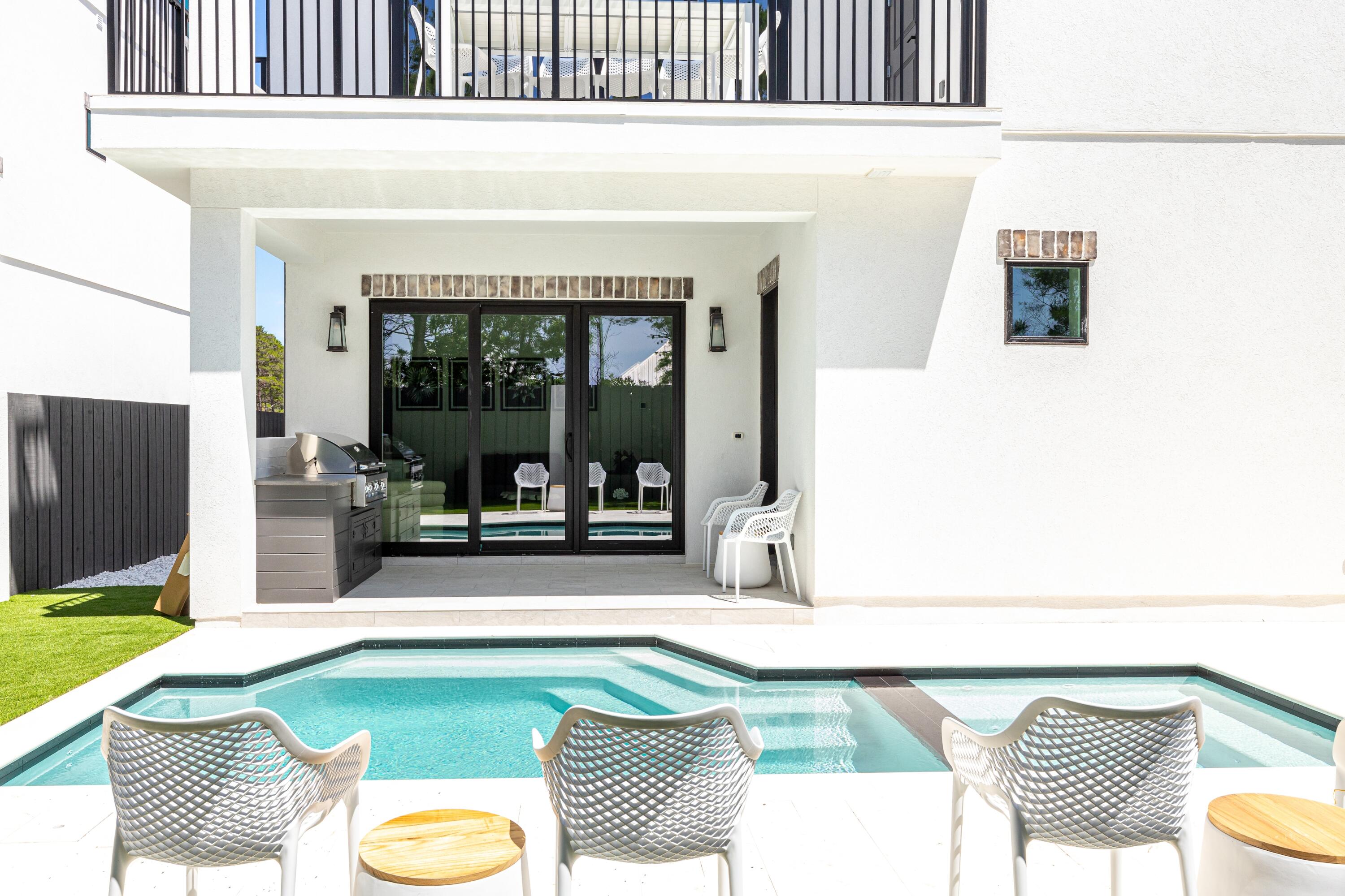 20 Sea Croft Drive Santa Rosa Beach, FL 32459 - Photo 8 of 54 a living room with a couch and a flat screen tv