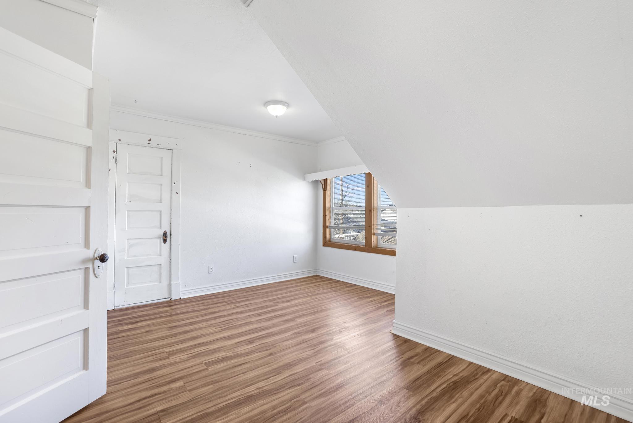 242 8th Avenue East Twin Falls, ID 83301 - Photo 18 of 35 Bonus room featuring wood finished floors and baseboards