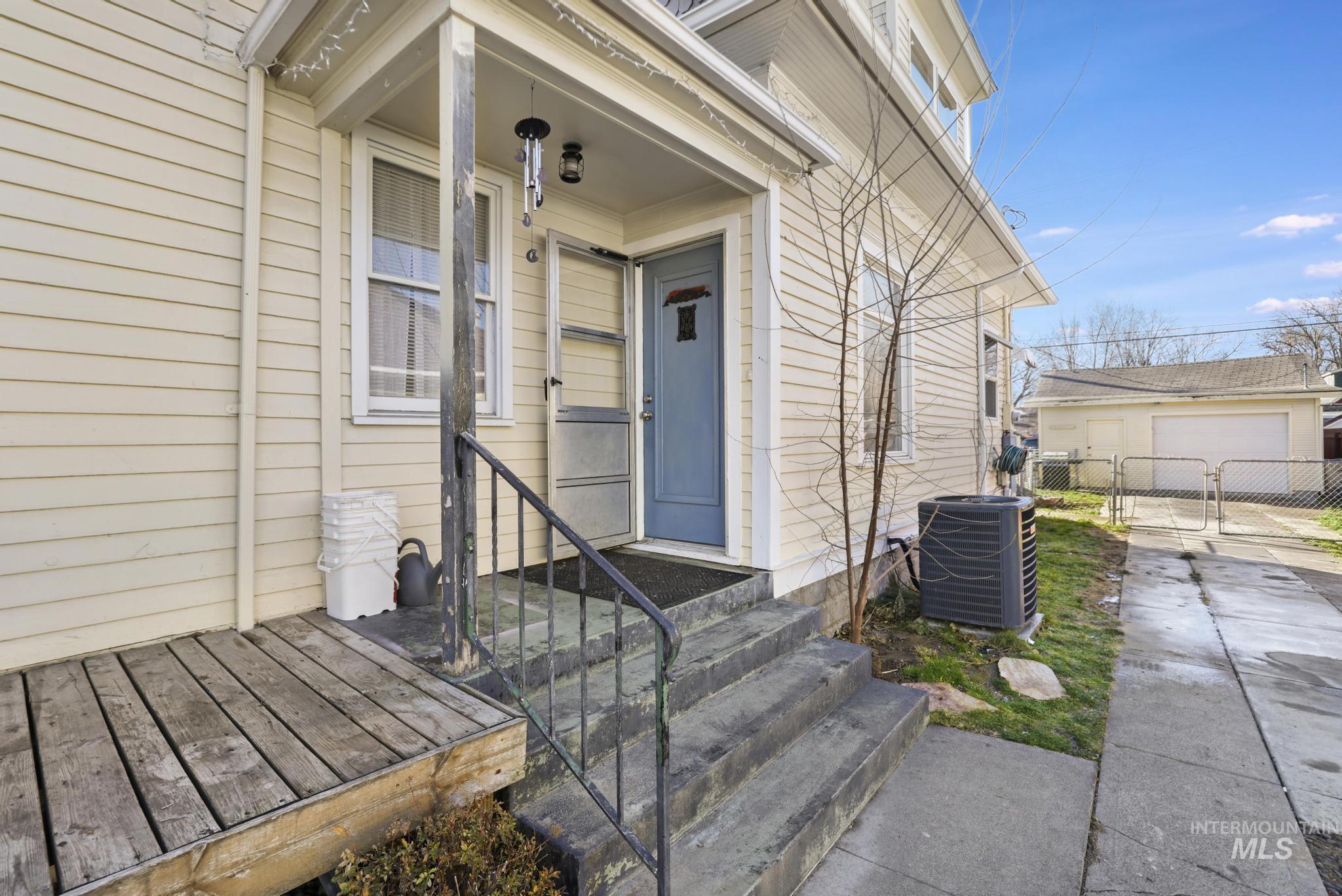 242 8th Avenue East Twin Falls, ID 83301 - Photo 3 of 35 View of exterior entry featuring a gate