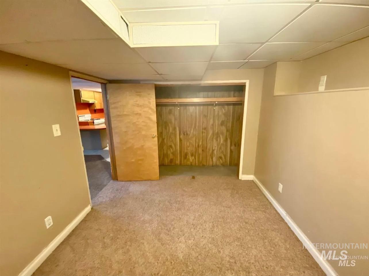 242 8th Avenue East Twin Falls, ID 83301 - Photo 31 of 39 Finished below grade area with a drop ceiling and light colored carpet