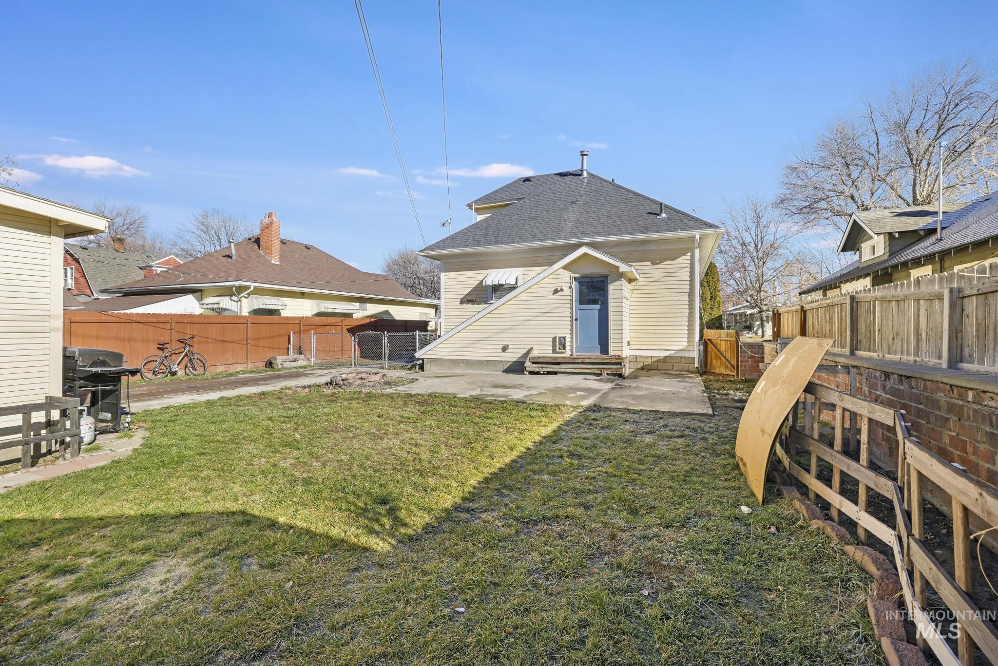 242 8th Avenue East Twin Falls, ID 83301 - Photo 33 of 35 Rear view of house featuring a patio area, a fenced backyard, and a gate