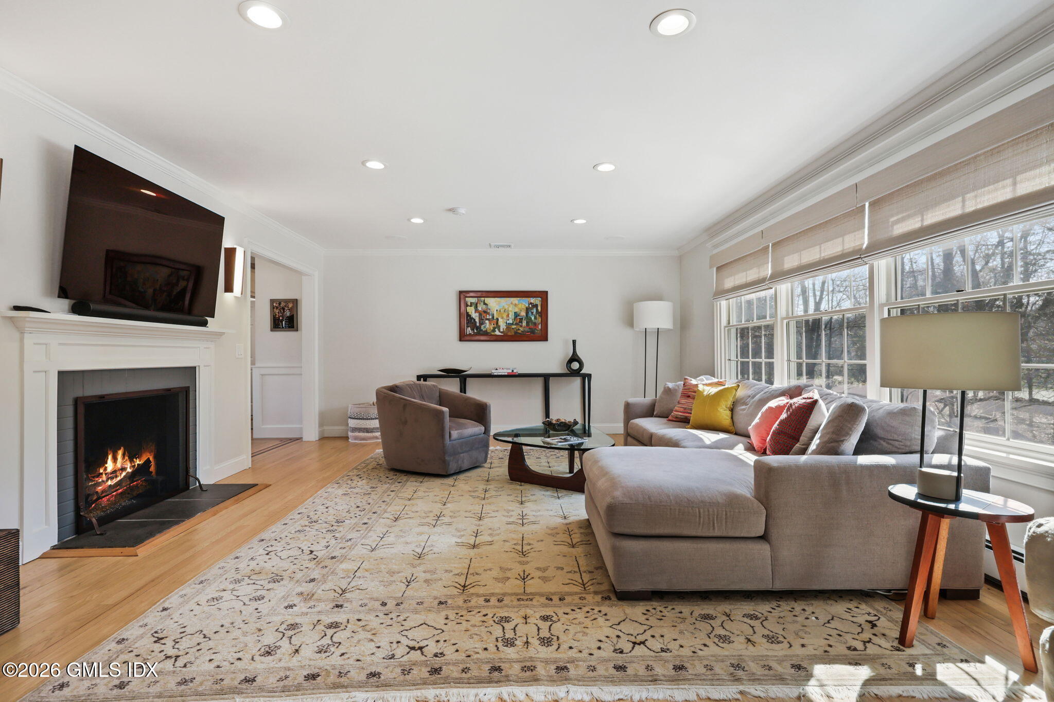 97 Davenport Ridge Lane Stamford, CT 06903 - Photo 6 of 31 a living room with furniture a flat screen tv and a fireplace