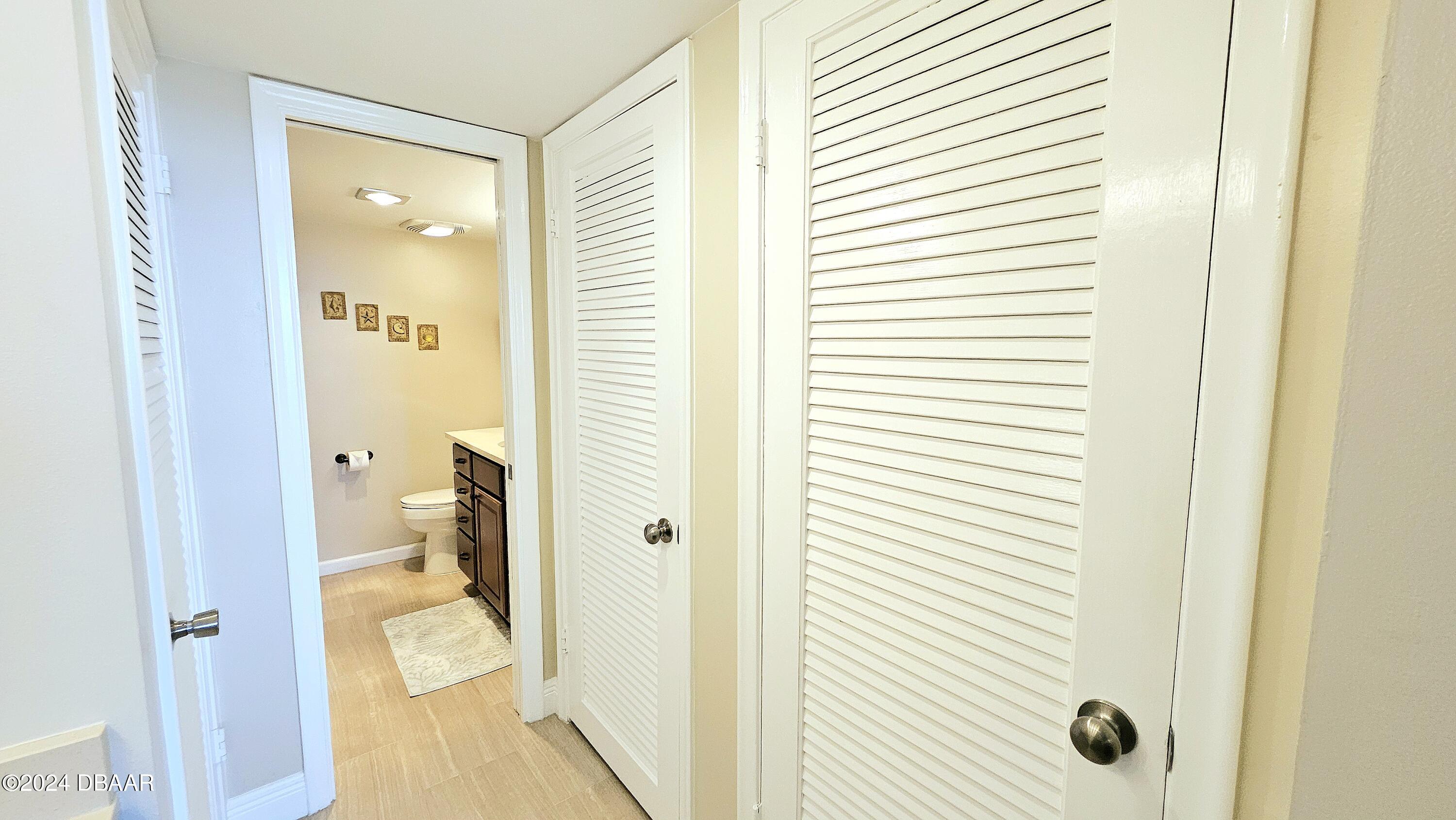 1575 Ocean Shore Boulevard, Unit 1003 Ormond Beach, FL 32176 - Photo 20 of 40 a bathroom with a granite countertop sink