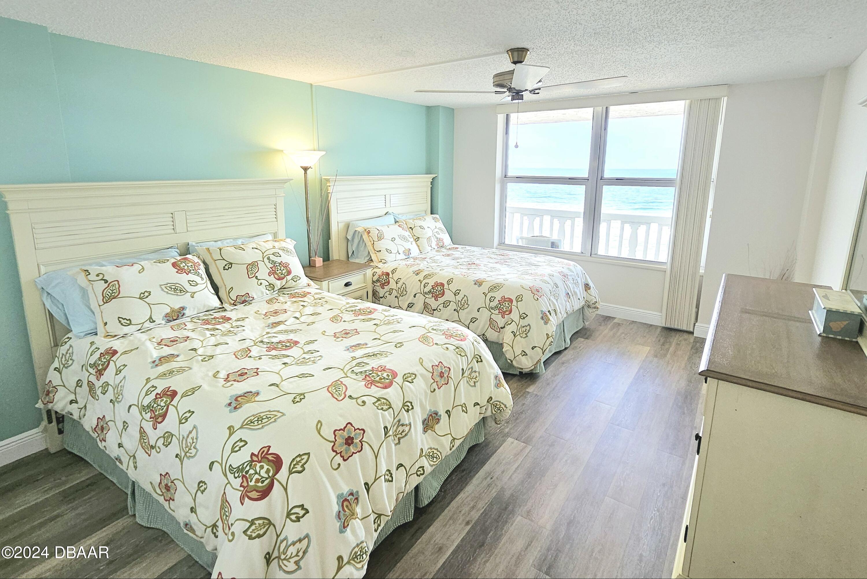1575 Ocean Shore Boulevard, Unit 1003 Ormond Beach, FL 32176 - Photo 22 of 40 a bedroom with double bed and a window