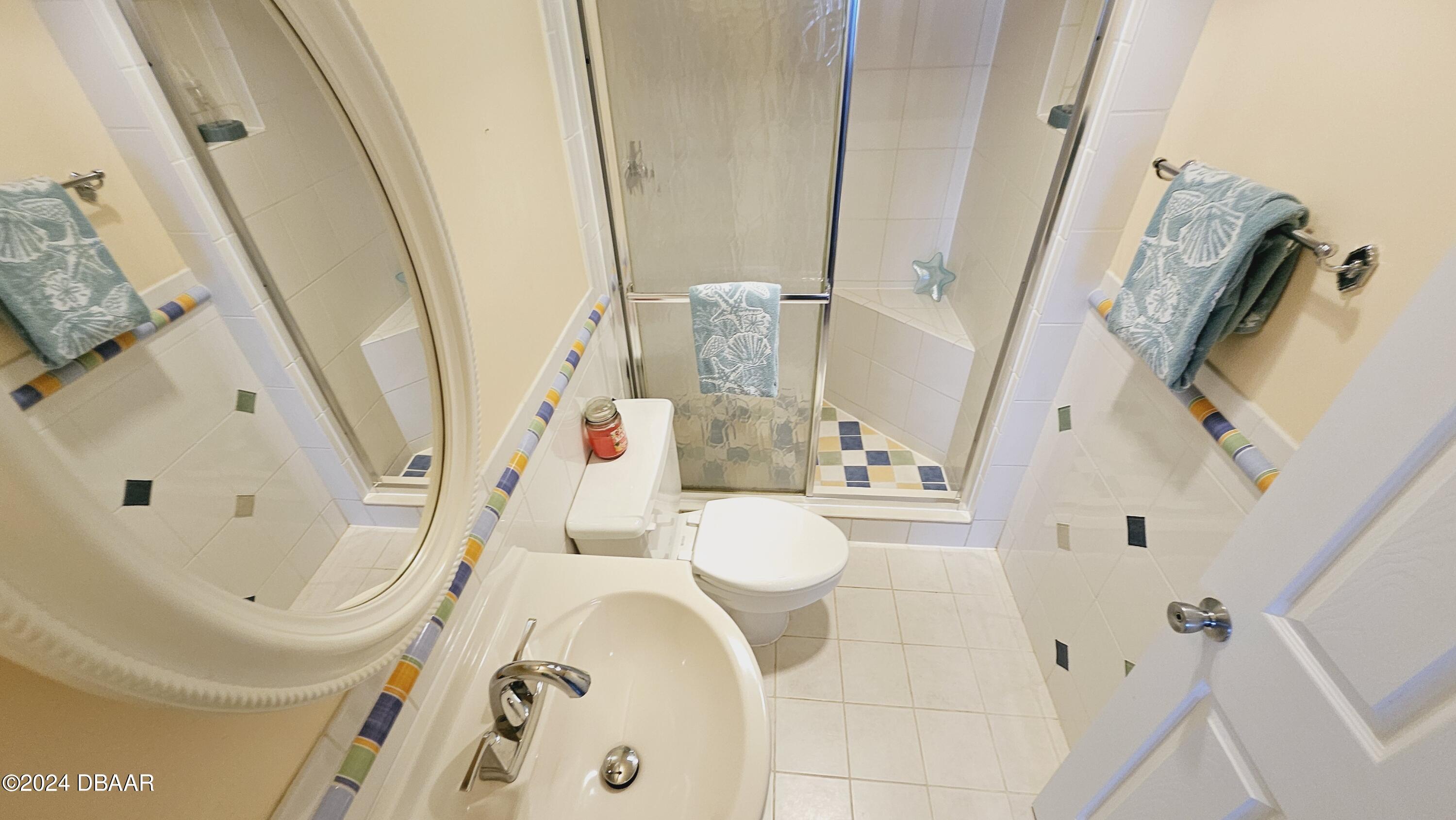 1575 Ocean Shore Boulevard, Unit 1003 Ormond Beach, FL 32176 - Photo 25 of 40 a bathroom with a sink and toilet