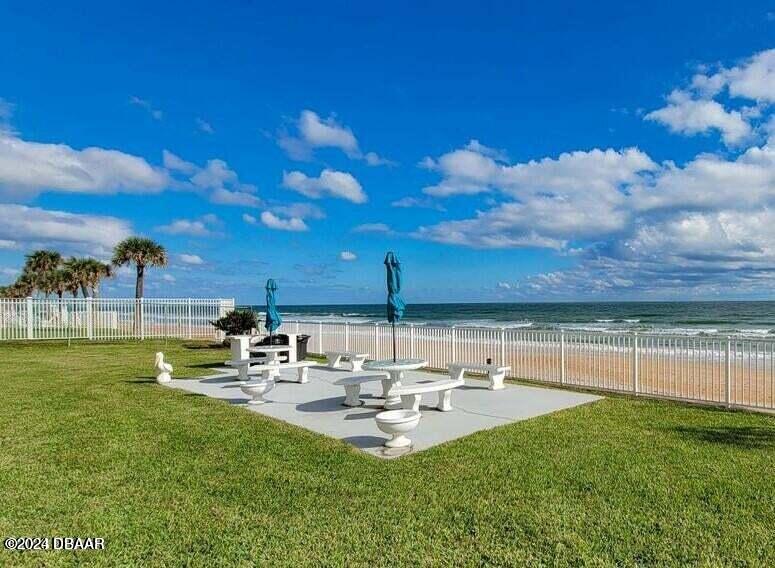 1575 Ocean Shore Boulevard, Unit 1003 Ormond Beach, FL 32176 - Photo 30 of 40 a view of a backyard with sitting area