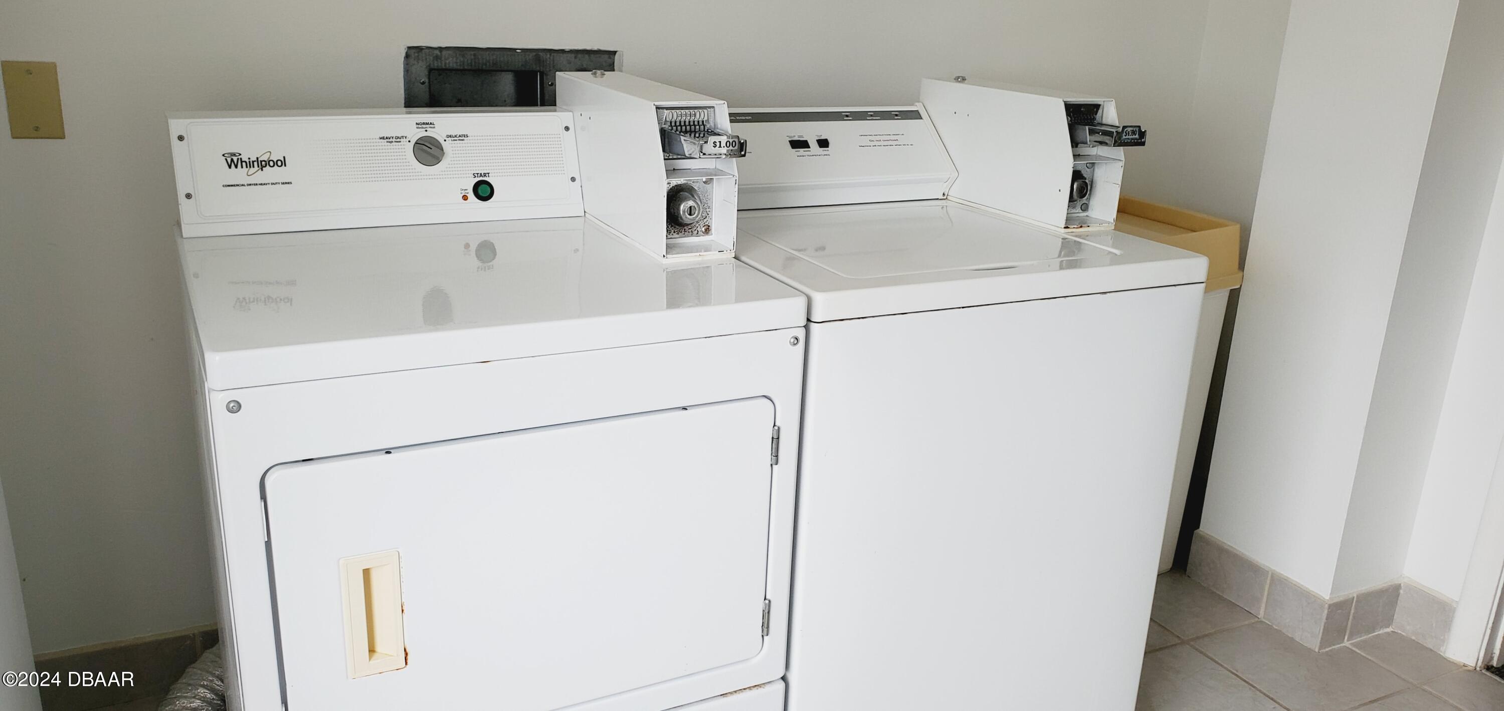 1575 Ocean Shore Boulevard, Unit 1003 Ormond Beach, FL 32176 - Photo 34 of 40 a utility room with dryer and washer