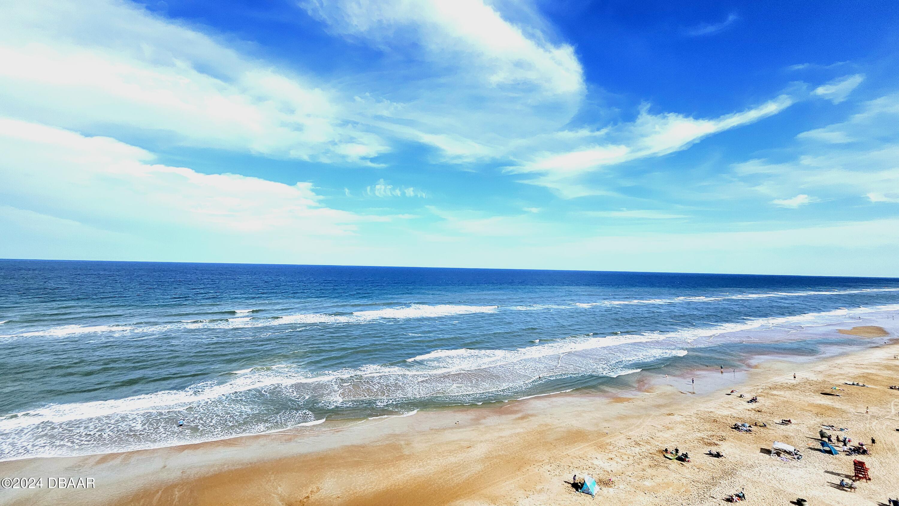 1575 Ocean Shore Boulevard, Unit 1003 Ormond Beach, FL 32176 - Photo 5 of 40 a view of an ocean and beach