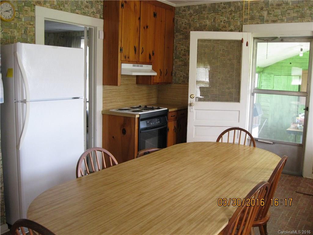 2824 Joe Johnson Road, Unit PTS 1 & 2 Catawba, NC 28609 - Photo 17 of 23 a kitchen with a stove a refrigerator and a table