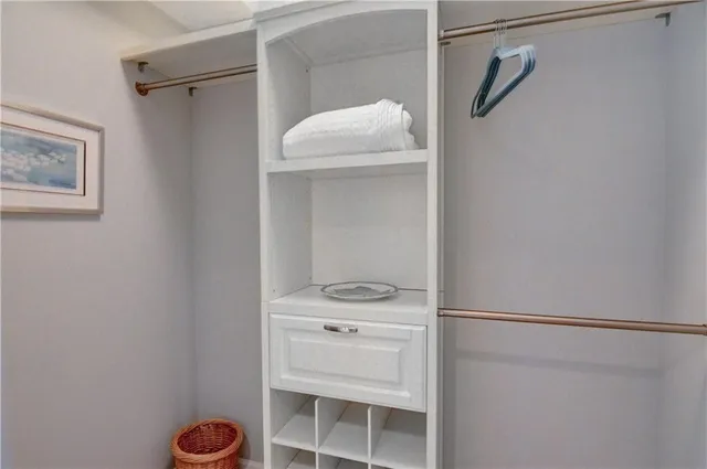 a living room with furniture a rug and a window