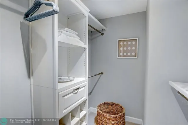 a bedroom with a bed and a television