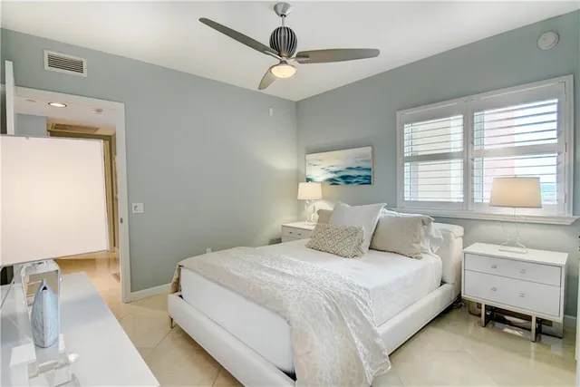 a kitchen with stainless steel appliances granite countertop a refrigerator a stove and a sink