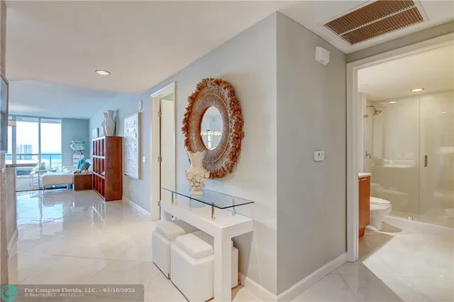 a living room with patio pool table and chairs