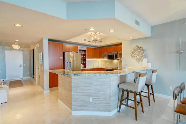 a view of swimming pool with outdoor seating and a garden