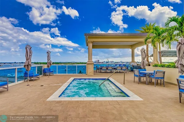 a view of a tennis ground with a large window