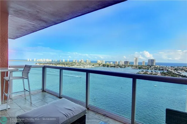 a living room with furniture and a mirror