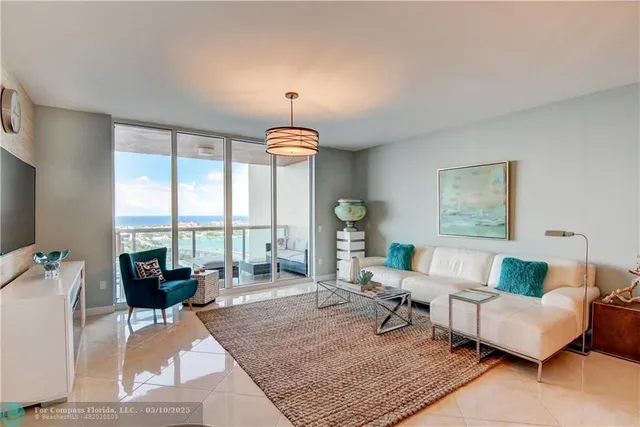 a bedroom with a bed a desk and chair with window