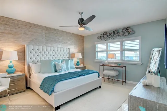 a spacious bathroom with a granite countertop sink a mirror and a shower